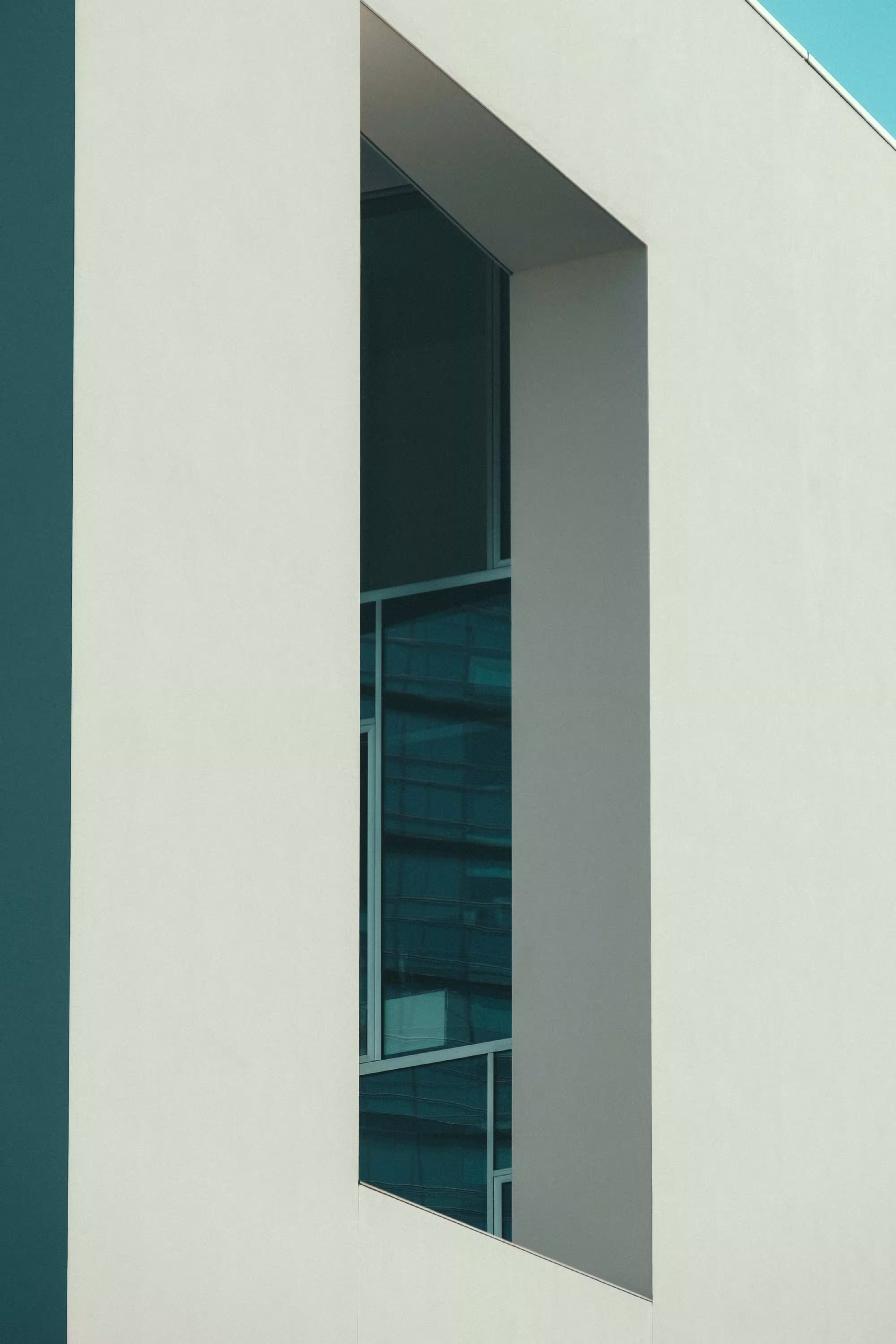 Low-angle Photography White Concrete Building Under Blue Sky.